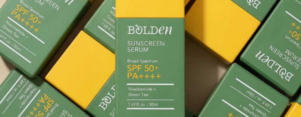 Multiple bottles of Bolden Sunscreen Serum SPF 50 PA++++ on a flat lay photography