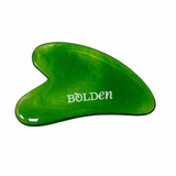 Green gua sha tool with 'Bolden' branding on a white background