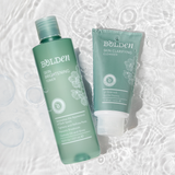 Bolden cleanser and toner against a background with water